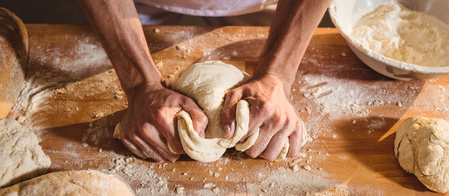 Hands moulding dough